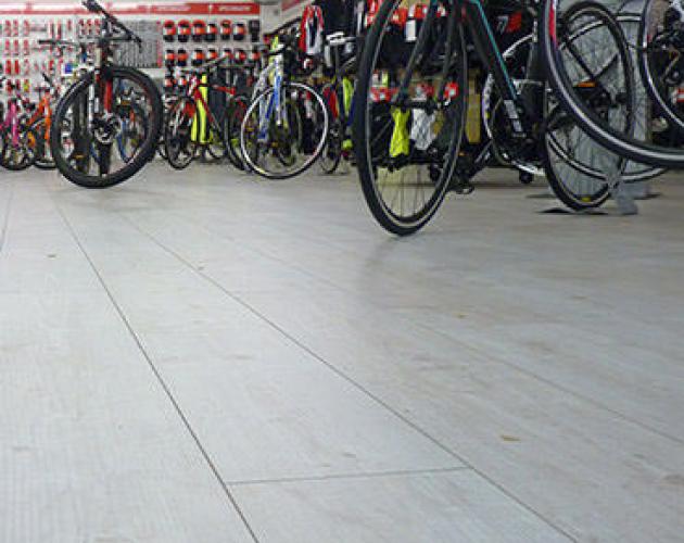 Bicycle Specialist Chooses Floor Covering Specialist